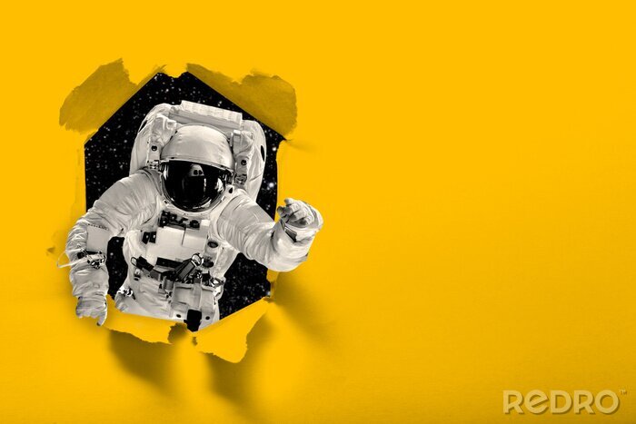 Papier peint  astronaut flies over the earth in space.