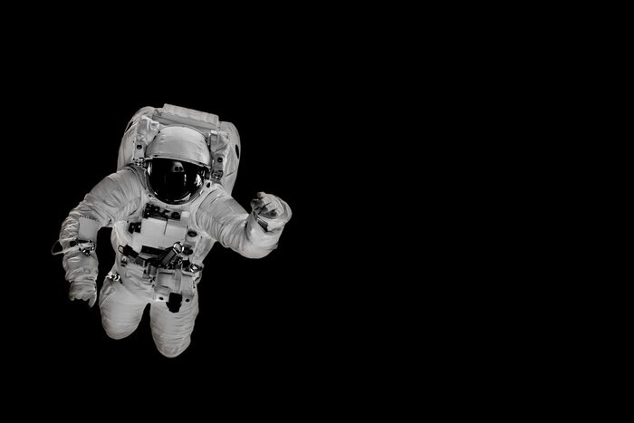 Papier peint  astronaut flies over the earth in space.