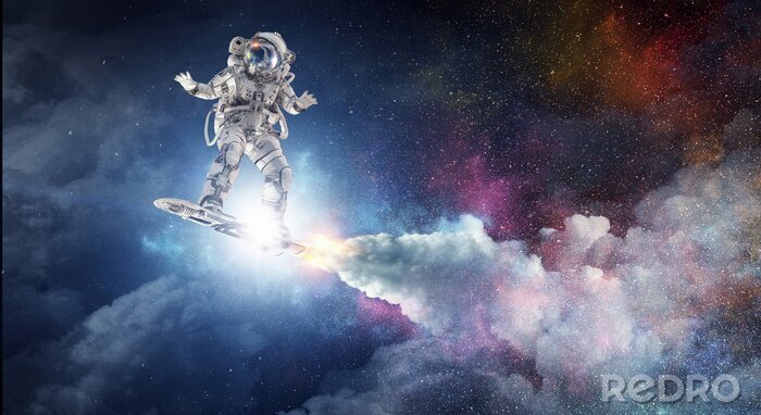Papier peint  Astronaute sur fond de galaxie colorée