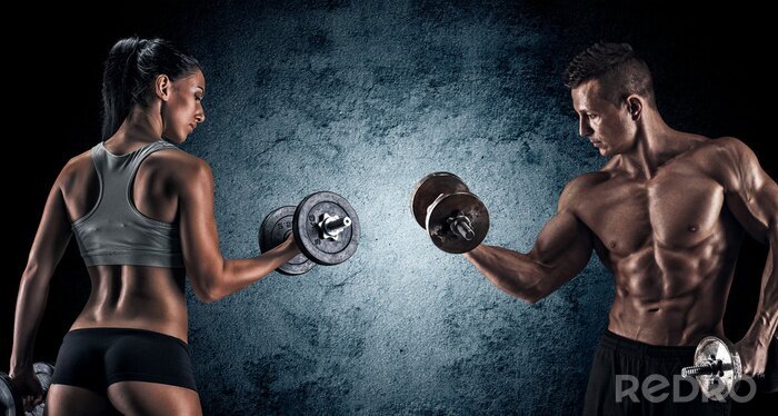 Papier peint  Athletic homme et femme avec des haltères.