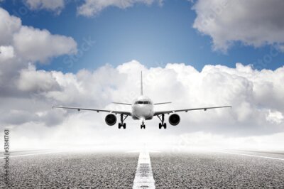 Papier peint  Avion décollant de la piste sur fond de nuages