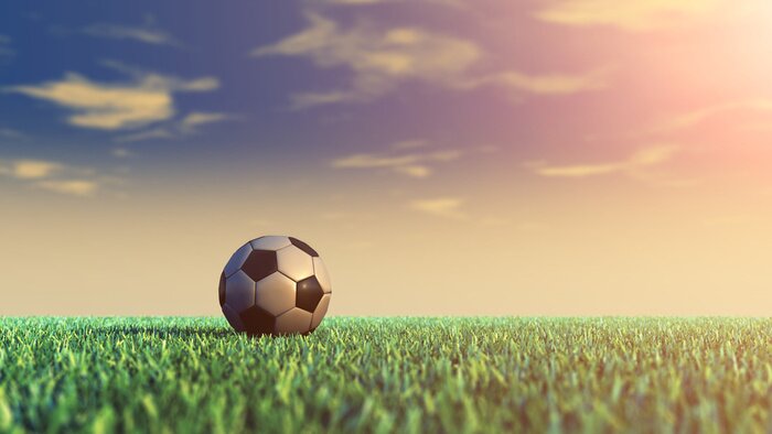 Papier peint  Ballon de football et coucher de soleil