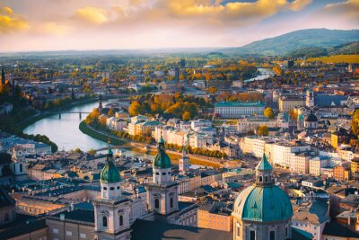 Papier peint  Beautiful of Aerial panoramic view in a Autumn season at a historic city of Salzburg with Salzach river in beautiful golden evening light sky and colorful of autumn at sunset, Salzburger Land, Austria