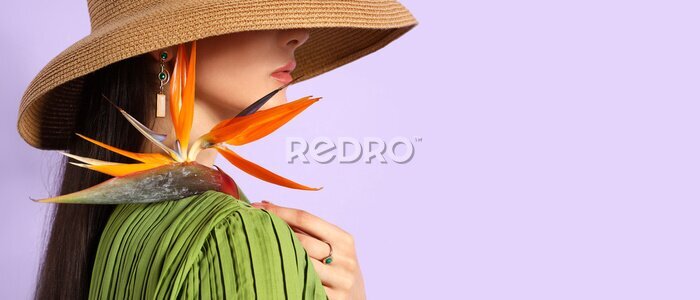 Papier peint  Beautiful young woman holding strelitzia flower on lilac background with space for text