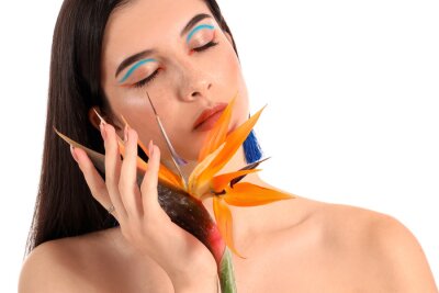 Papier peint  Beautiful young woman with strelitzia flower isolated on white