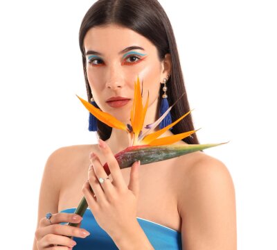 Papier peint  Beautiful young woman with strelitzia flower isolated on white