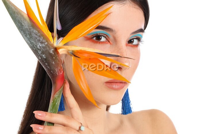 Papier peint  Beautiful young woman with strelitzia flower isolated on white