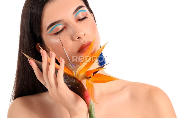 Papier peint  Beautiful young woman with strelitzia flower isolated on white