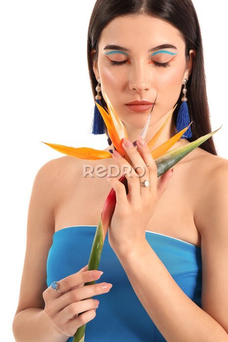 Papier peint  Beautiful young woman with strelitzia flower isolated on white