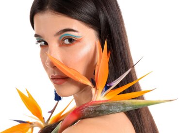Papier peint  Beautiful young woman with strelitzia flowers isolated on white