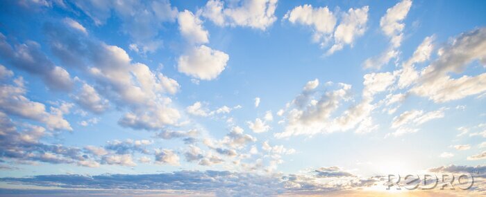 Papier peint  Blue sky clouds background. Beautiful landscape with clouds and orange sun on sky