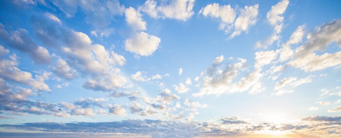 Papier peint  Blue sky clouds background. Beautiful landscape with clouds and orange sun on sky