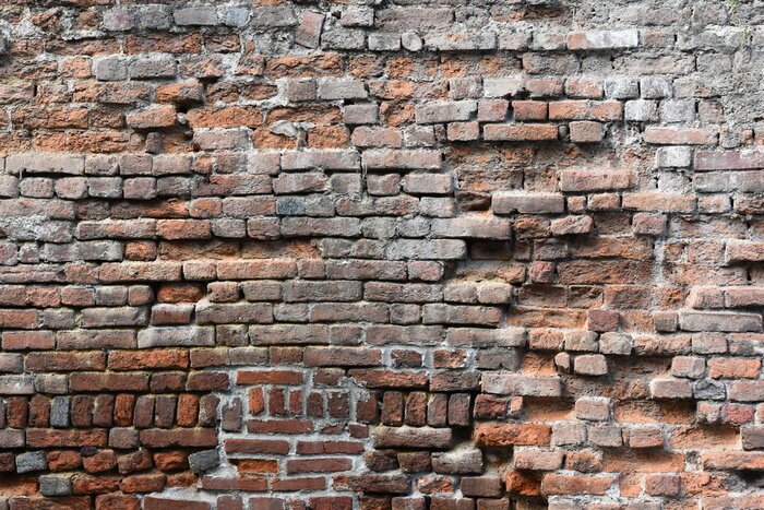 Papier peint  Brique 3D se détachant d'un mur