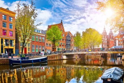 Channel in Amsterdam Netherlands houses river Amstel landmark