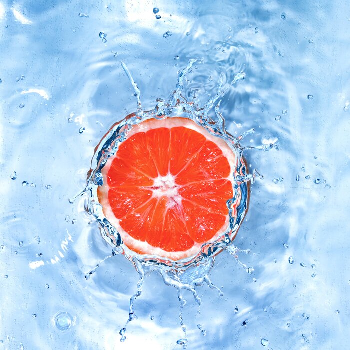 Papier peint  Citron frais tombé dans l'eau avec des bulles isolées sur blanc