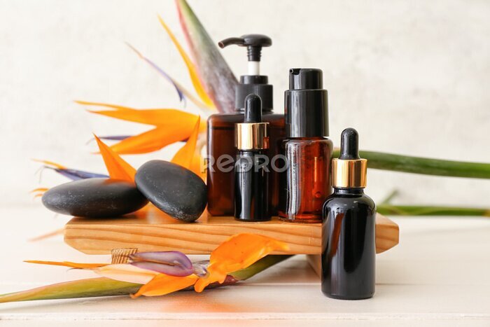 Papier peint  Composition with different cosmetic products and strelitzia flowers on light background