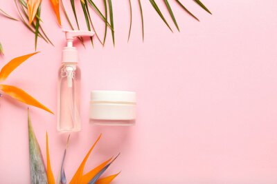 Papier peint  Cosmetic products and strelitzia flowers on pink background