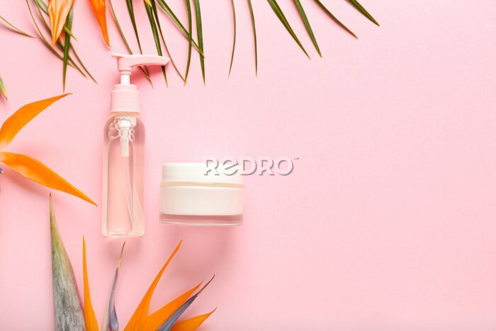 Papier peint  Cosmetic products and strelitzia flowers on pink background