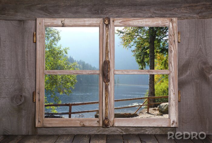 Papier peint  Des arbres et un lac vu à travers une fenêtre