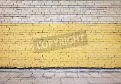 Papier peint  Des briques jaunes sur un mur blanc