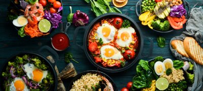 Dishes background. Set of dishes on the dining table. Food. Traditional cuisines of the world. Top view. Free space for your text.