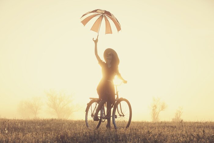 Papier peint  Femme sur un vélo avec un parapluie