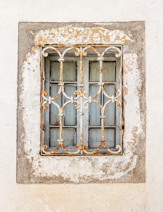 Papier peint  Fenêtre derrière de vieux barreaux