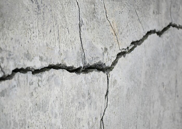 Papier peint  Fissures mur gris
