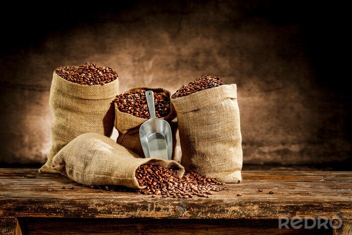 Papier peint  Fresh old sack of coffee grains and brown old wall background 