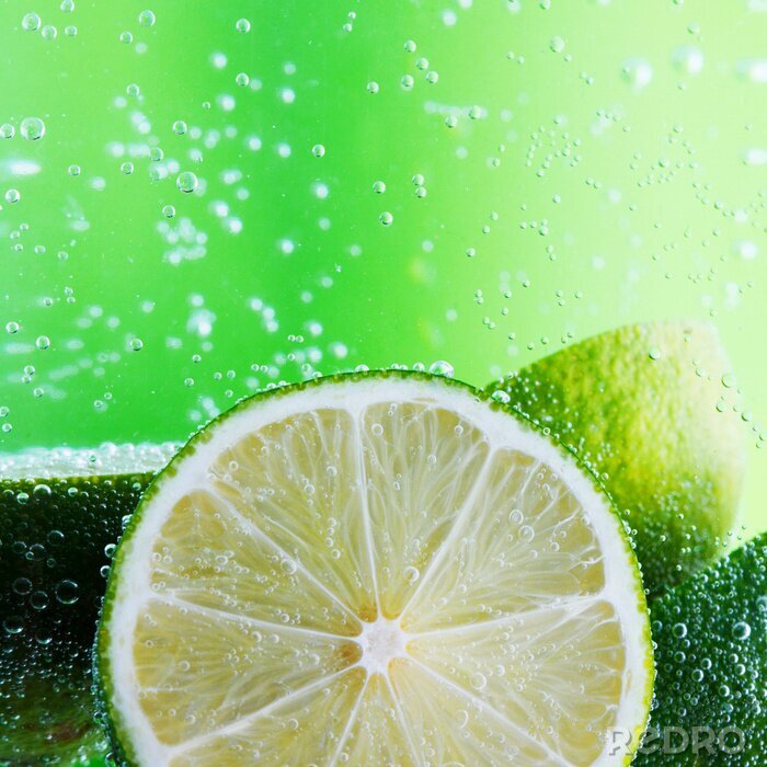 Papier peint  Fruit du citron vert sur fond vert