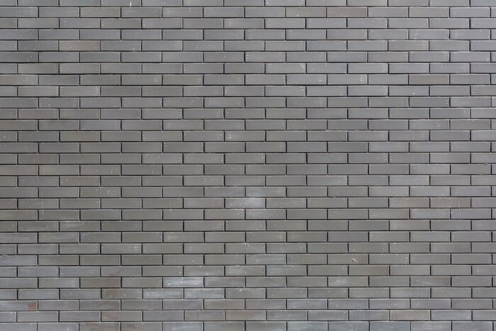 Papier peint  Grey brick wall..