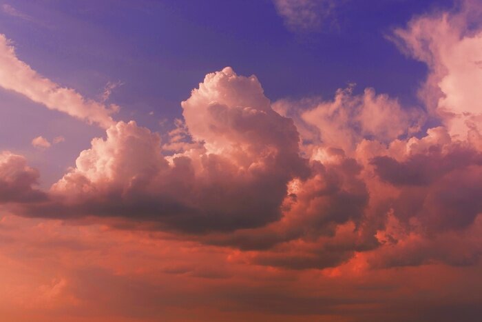 Papier peint  Gros nuages au coucher du soleil
