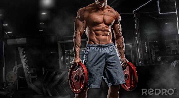 Papier peint  Homme musclé avec des poids
