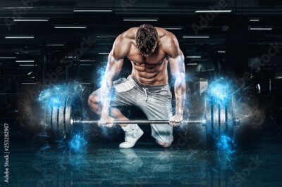 Papier peint  Homme musclé avec des poids à la salle de sport