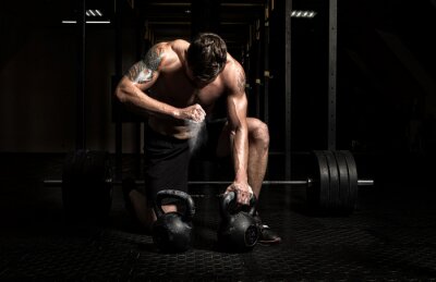 Papier peint  Homme musclé soulevant des poids