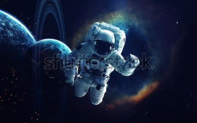 Papier peint  L'espace et un astronaute