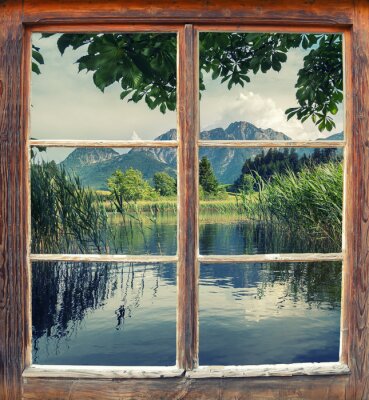 Papier peint  Lac et nature derrière une fenêtre