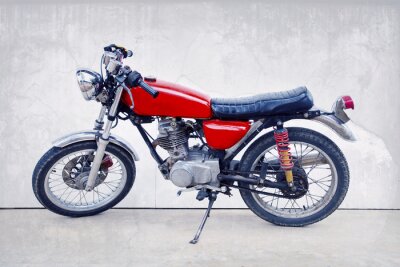 Papier peint  le style vintage de couleur de vieille moto debout classique contre w