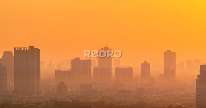 Papier peint  Lever de soleil d'aura orange sur le paysage urbain