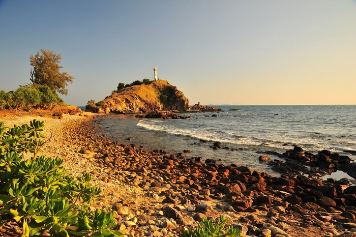 Papier peint  Mer et phare au coucher du soleil