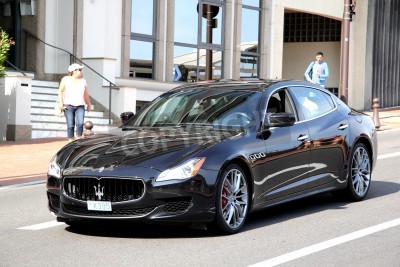 Papier peint  MONTE CARLO, MONACO - AUGUST 2, 2014: Black luxury sedan Maserati Quattroporte at the city street.