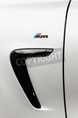 Papier peint  MUNCHEN, GERMANY - APRIL 06, 2015: BMW M sign on rear side of a sports car. BMW M GmbH (previously: BMW Motorsport GmbH) is a subsidiary of German car manufacturer BMW AG.