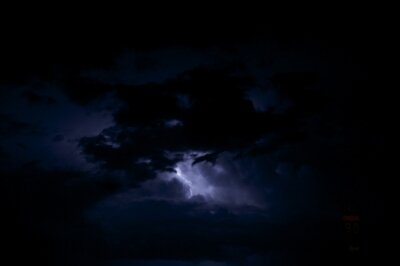 Papier peint  Night Storm - Lightning Storm. Dark Stormy Sky with Lightning Between Clouds. Sever Weather Photo Collection.