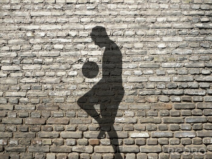 Papier peint  Ombre d'un footballeur qui jongle