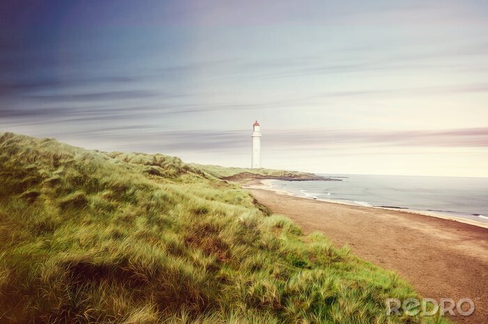 Papier peint  Panorama d'une plage avec un phare