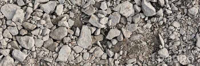 Papier peint  Panoramic image. Gray gravel stones for the underground in road construction