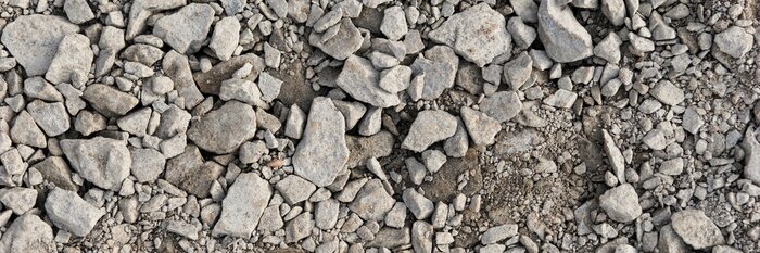 Papier peint  Panoramic image. Gray gravel stones for the underground in road construction