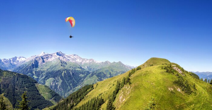 Papier peint  Parapente au-dessus des montagnes