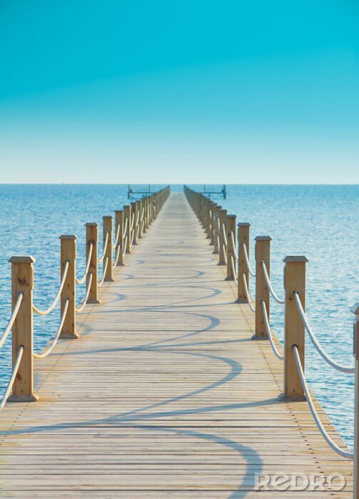 Papier peint  Passerelle sur fond de ciel d'azur