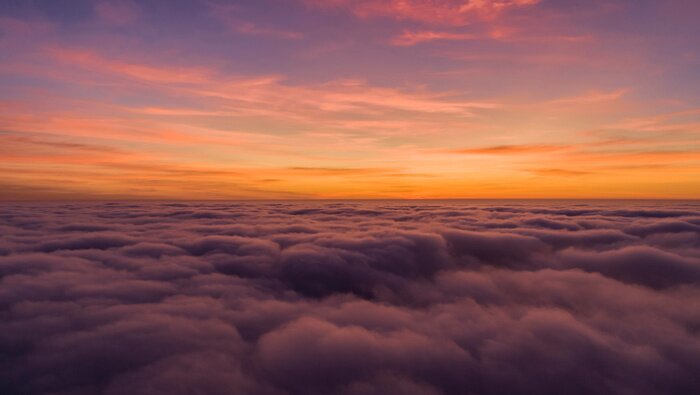 Papier peint  Paysage orange avec nuages